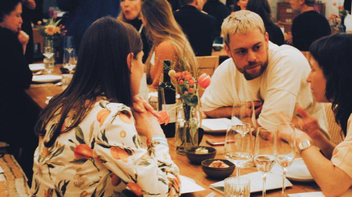 People sitting around a dinner table during the networking event Get Intimate With Us in Berlin