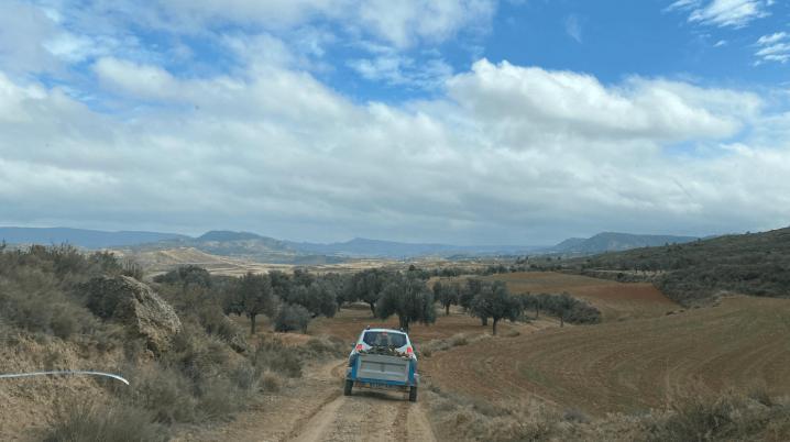 Car driving on a desrted road in the countryside in Spain